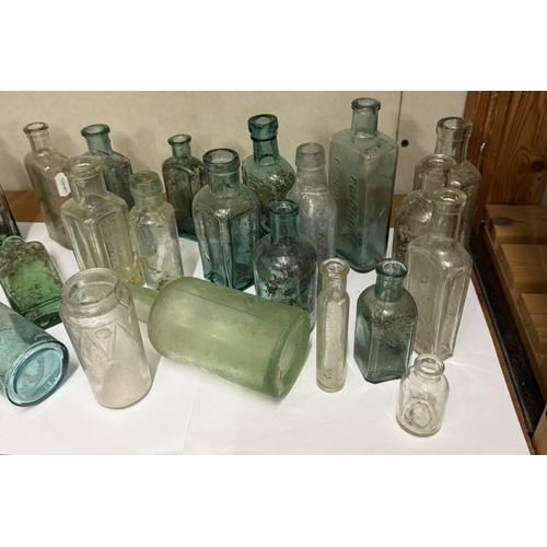 727 - A shelf of vintage glass bottles