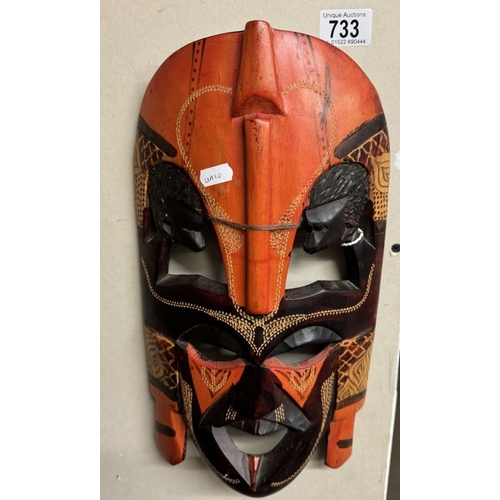 733 - A painted wooden tribal mask