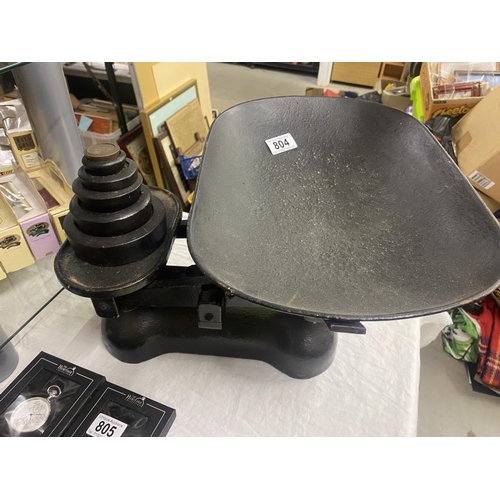 804 - A large set of cast iron scales and weights