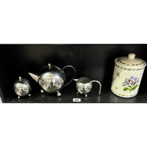 808 - A teapot, sugar bowl, milk jug and lidded pot