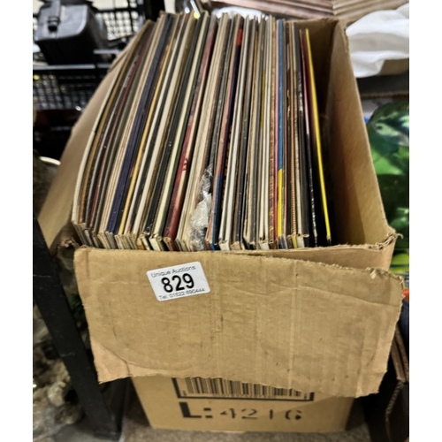 829 - A box of lp's and some 12 inch singles, Communards, Buddy Holly etc