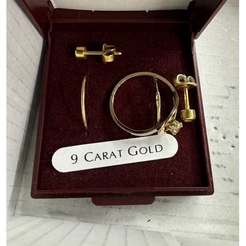 851 - A small metal casket with 9ct gold earrings and ring