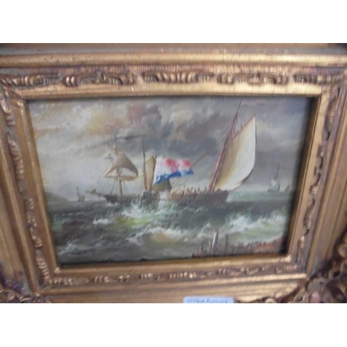 605 - A gilt framed overpainted print of a seascape.