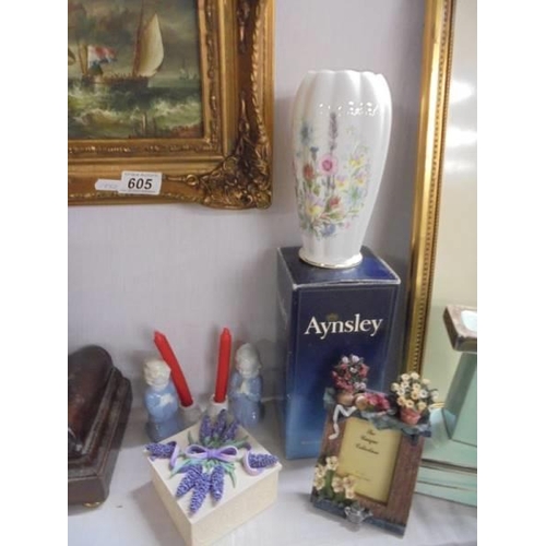 606 - A mixed lot including photo frames, Aynsley vase etc.,