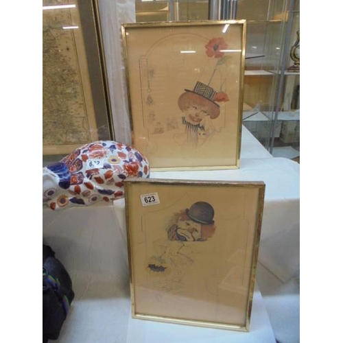 623 - A pair of framed and glazed clown prints,