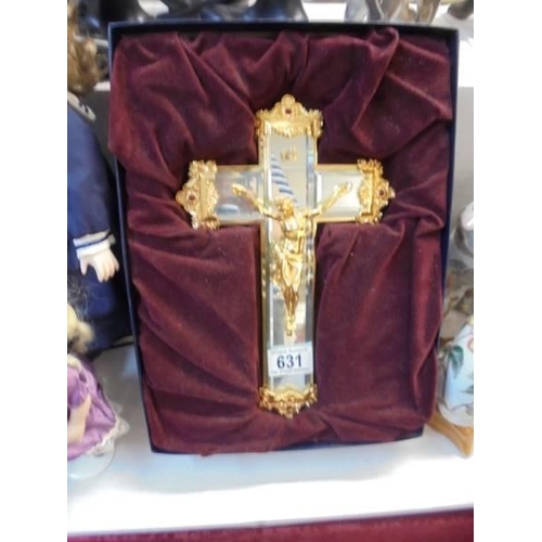 631 - A boxed bevelled glass and gilt crucifix.