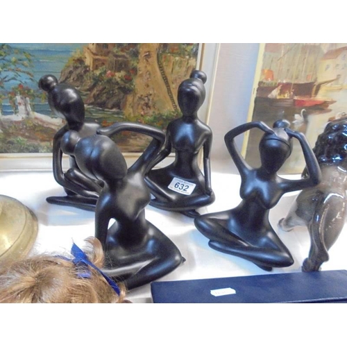 632 - Four modern black ceramic figures.