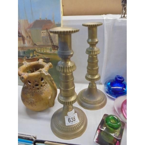 638 - A pair of brass candlesticks.