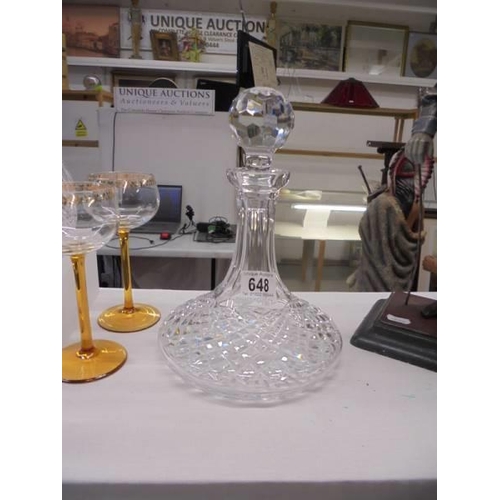 648 - A cut glass ships decanter.