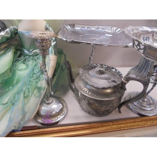 649 - Two metal cake stands with figural bases, a candlestick and a teapot.