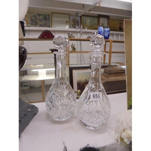 656 - A pair of good quality cut glass decanters.