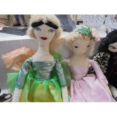 653 - Four hand made art dolls.