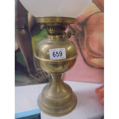 659 - A brass oil lamp with etched shade, COLLECT ONLY.