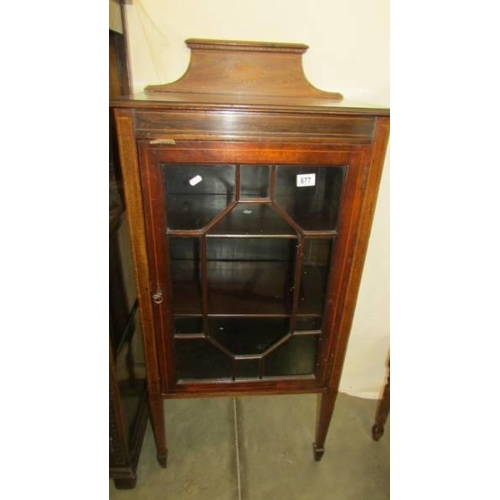 677 - An Edwardian mahogany inlaid single door display cabinet. COLLECT ONLY.