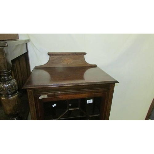 677 - An Edwardian mahogany inlaid single door display cabinet. COLLECT ONLY.