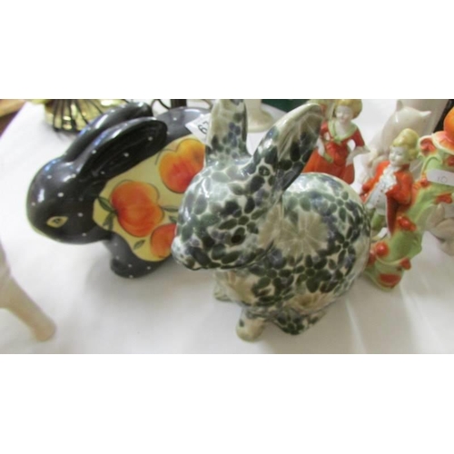 679 - A mixed lot of ceramics including rabbits etc.,