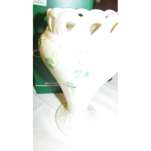 682 - A pair of boxed Belleek vases. (one has chip to rim).