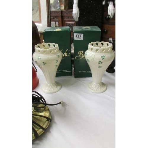 682 - A pair of boxed Belleek vases. (one has chip to rim).