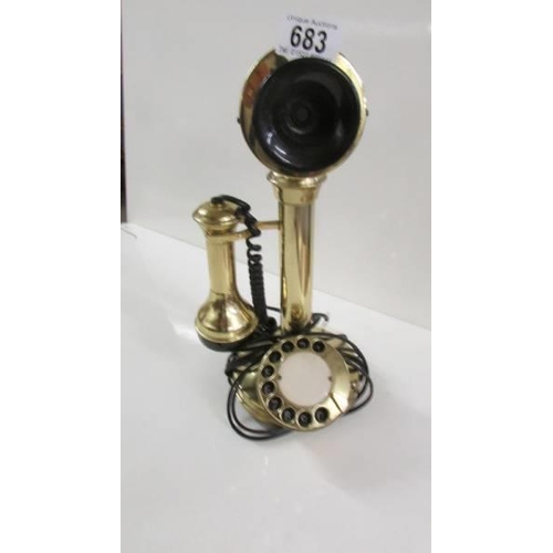 683 - A modern brass candlestick telephone.