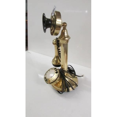 683 - A modern brass candlestick telephone.