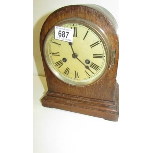 687 - An Edwardian oak mantle clock.