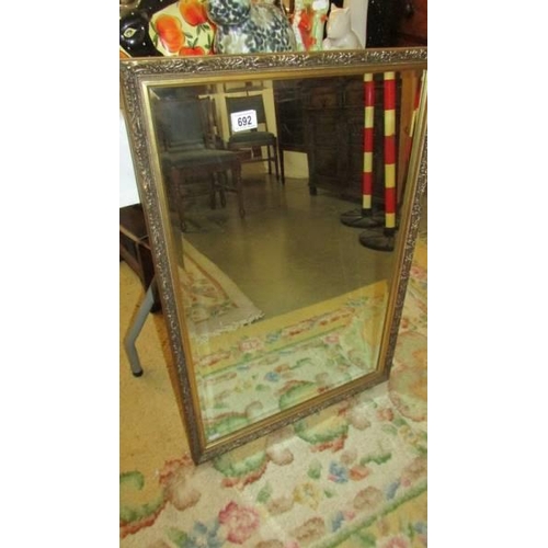 692 - A gilt framed bevel edged mirror, COLLECT ONLY.