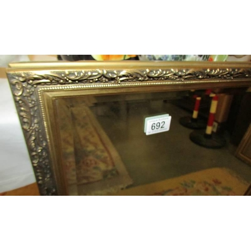 692 - A gilt framed bevel edged mirror, COLLECT ONLY.