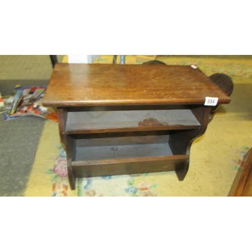 694 - A good oak stool incorporating a magazine rack. COLLECT ONLY.