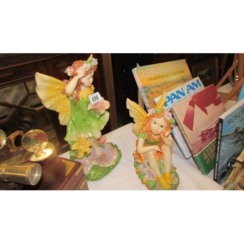 696 - Two good fairy figures.