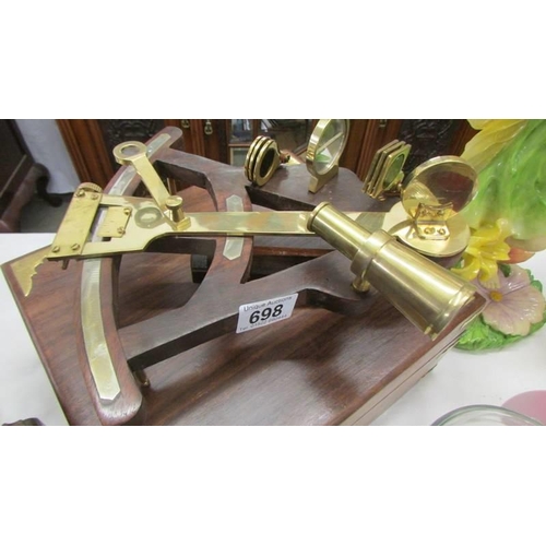 698 - A boxed brass sextant.