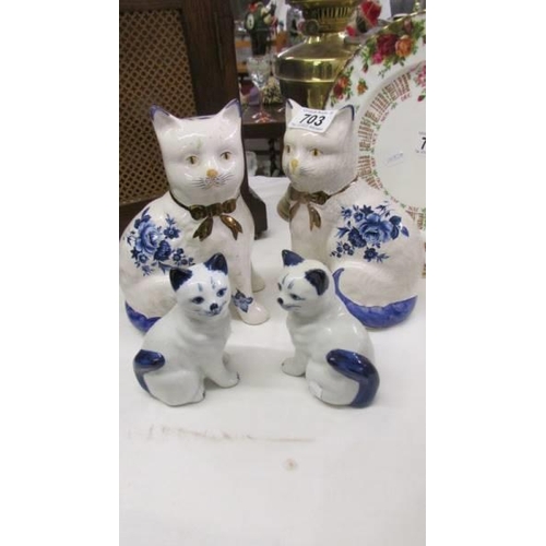 703 - Two pairs of Staffordshire cats.