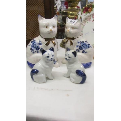 703 - Two pairs of Staffordshire cats.