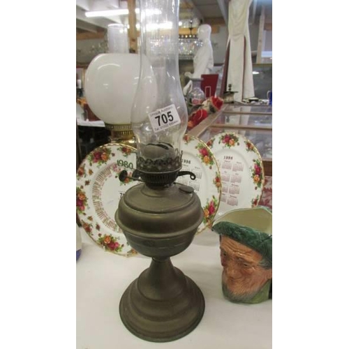 705 - An old brass oil lamp with Duplex double burner, COLLECT ONLY.