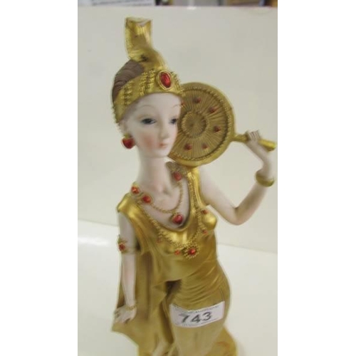 743 - An art deco style gilded figure.