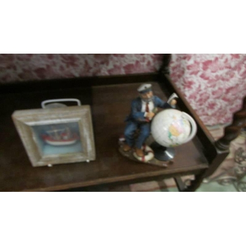 752 - A table globe, a Wallace and Gromit ornament and two other items.