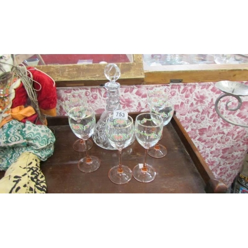 753 - A good cut glass decanter and six hand painted wine glasses. COLLECT ONLY.