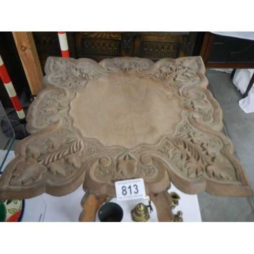 813 - A small carved folding table, COLLECT ONLY.