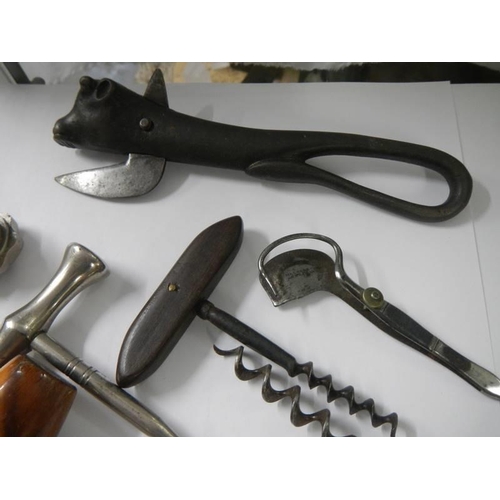 820 - A mixed lot of bottle openers, corkscrews and other items including Wilkinson Sword.