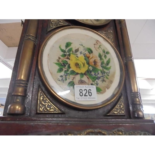 826 - An arched top brass mounted eight day mantel clock. COLLECT ONLY.