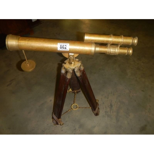 862 - A brass telescope on tripod for ornamental use only,