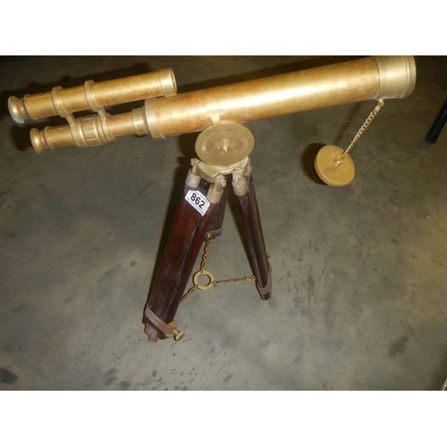 862 - A brass telescope on tripod for ornamental use only,