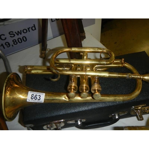 863 - A cased brass cornet.