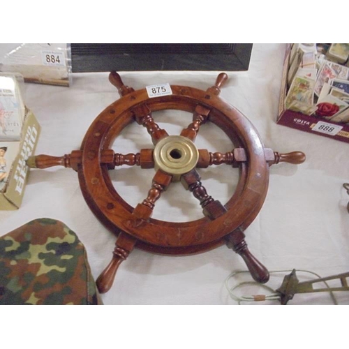 875 - A small ship's wheel.