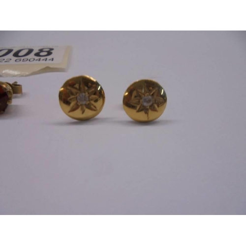 1008 - Three pairs of yellow metal stud earrings.