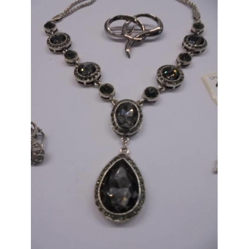 1020 - A good quality necklace, a pair of marcasite earrings, a brooch and a pair of silver leaf earrings.