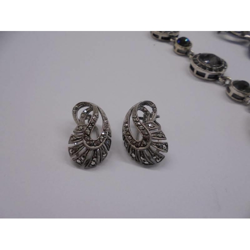 1020 - A good quality necklace, a pair of marcasite earrings, a brooch and a pair of silver leaf earrings.