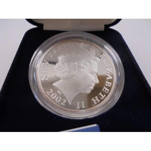 1104 - A New Zealand silver frosted proof 2002 five dollar coin- Hector's Dolphin.