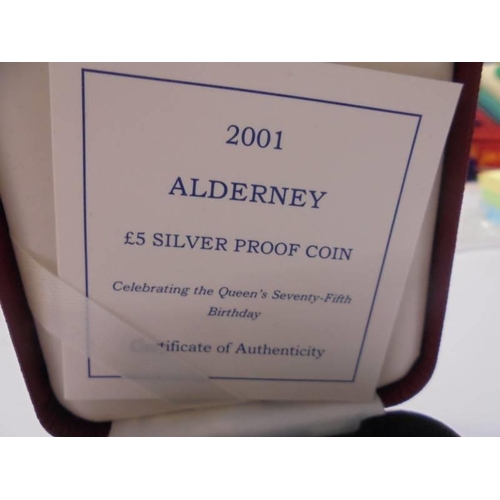 1109 - A 2001 Alderney £5 silver proof coin celebrating Queen Elizabeth II seventy fifth birthday.