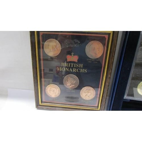 1125 - A framed and glazed British Monarchs coins, a 2004 proof coin set and a Henry VIII £5 coin.