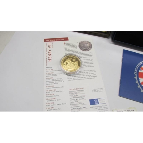 1125 - A framed and glazed British Monarchs coins, a 2004 proof coin set and a Henry VIII £5 coin.